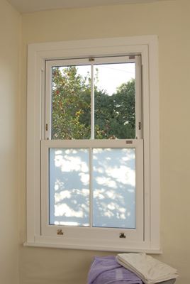White wooden sash bathroom window with Silver Mist glass effect and gold window furniture