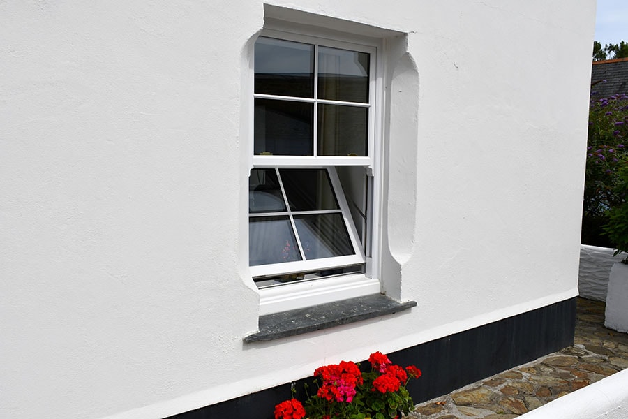 White uPVC tilt and slide sash window exterior