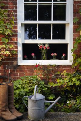 White wooden sash window with double glazing and cottage bars from the Anglian sash windows range