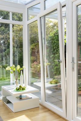 uPVC tilt and turn window finished in white on modern conservatory from the Anglian tilt and turn window range