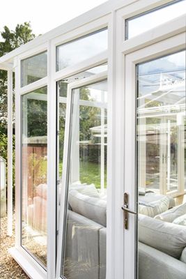 uPVC tilt and turn window finished in white on garden room conservatory from the Anglian tilt and turn window range