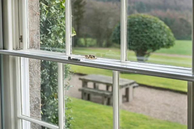 Close up of secondary glazing on a sash window in white from the Anglian secondary glazing range