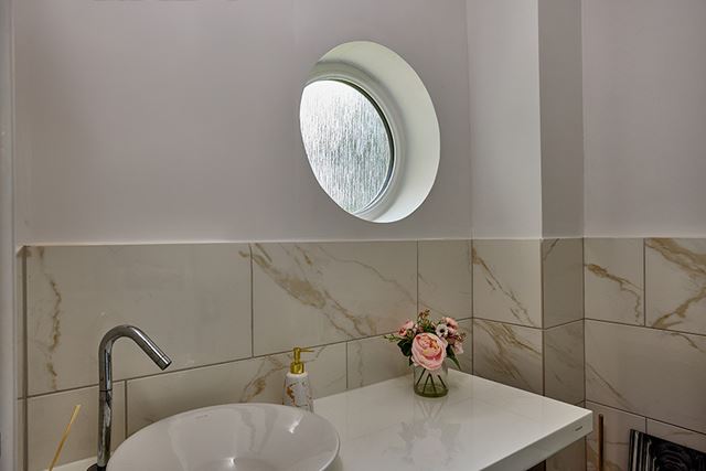 Circle shaped round window in bathroom