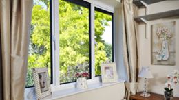 Aluminium bedroom casement window with white window handles from the Anglian aluminium window range