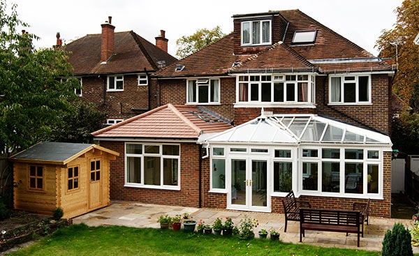 A combined extension and White uPVC conservatory