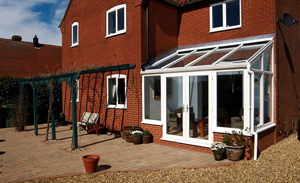 Small white uPVC lean to conservatory from the Anglian lean to conservatory range