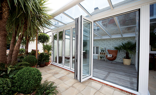 Close up of aluminium conservatory bifold doors in White from Anglian Home Improvements