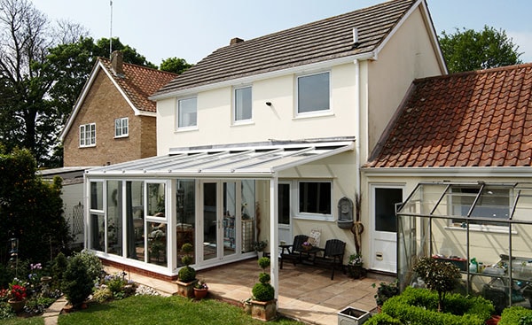 Garden view of White uPVC veranda conservatory from the Anglian conservatory range