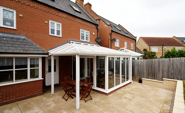 White uPVC veranda conservatory garden view from the Anglian conservatory range