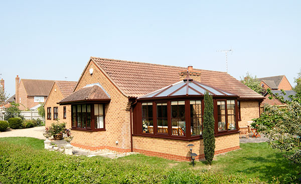 Classic uPVC bungalow conservatory in Dark Woodgrain from Anglian Home Improvements