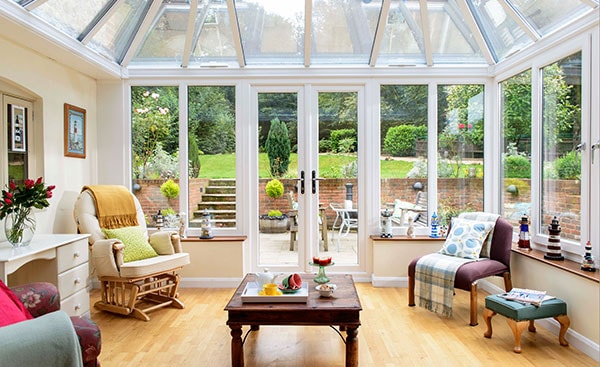 Large white uPVC Edwardian conservatory with French doors from the Anglian conservatory range