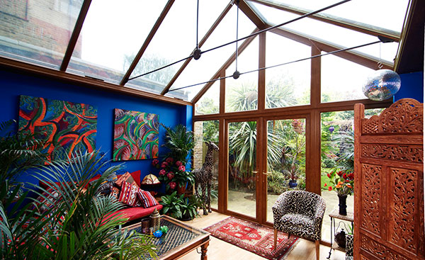 Interior view of large gable end uPVC conservatory in Golden Oak from Anglian Home Improvements