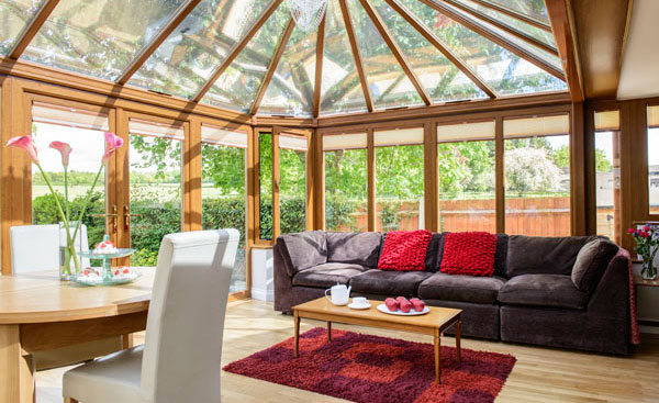 Interior view of large garden room conservatory in Golden Oak from Anglian Home Improvements