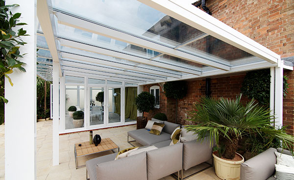 Finished living space with white UPVC veranda conservatory and patio area from Anglian Home
