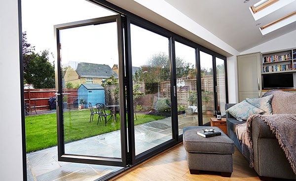 Large bifold doors in Jet Black five panel design from Anglian Home Improvements