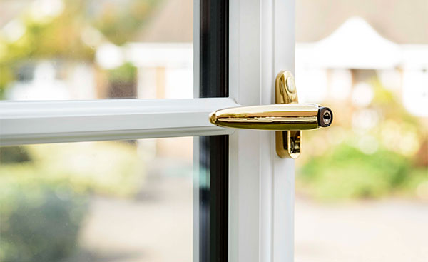 Gold handle on a White Knight uPVC window
